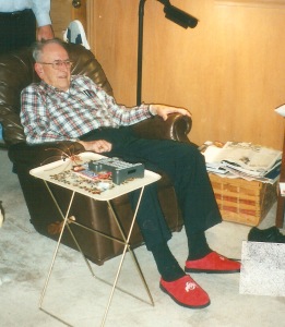 Daddy, watching the 2003 Fiesta Bowl in his magical Ohio State house shoes!